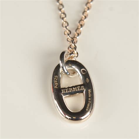 hermes silver pendant necklace.